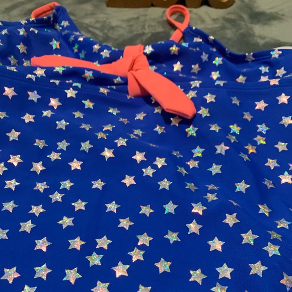 Blue with a iridescent star print bathing suit. - Picture 2 of 5